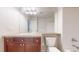 Bathroom featuring a sink, cabinets, mirror, toilet, and a shower and tub at 3985 W 104Th Dr # E, Westminster, CO 80031