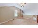 Loft bedroom featuring a ceiling fan and window, with views of the stairs at 3985 W 104Th Dr # E, Westminster, CO 80031