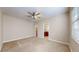 Large, bright bedroom featuring a ceiling fan, closet, and an entrance to the bathroom at 3985 W 104Th Dr # E, Westminster, CO 80031