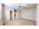 Spacious bedroom with a ceiling fan, closet, and an entrance leading to the stairs at 3985 W 104Th Dr # E, Westminster, CO 80031
