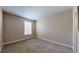 Bright bedroom with neutral walls and carpeting, plus natural light from a window at 3985 W 104Th Dr # E, Westminster, CO 80031