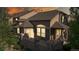 Charming townhome with stone accents, a private balcony, and warm evening glow at 3985 W 104Th Dr # E, Westminster, CO 80031