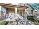 Inviting front entrance with stone pillars, water fountain, and well-maintained landscaping at 3985 W 104Th Dr # E, Westminster, CO 80031