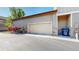 Attached garage with exterior stone accents and lush landscaping at 3985 W 104Th Dr # E, Westminster, CO 80031