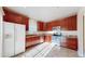Well-lit kitchen features tile floors, stainless steel appliances, and granite countertops at 3985 W 104Th Dr # E, Westminster, CO 80031