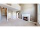 Spacious living room with soaring ceilings, fireplace, and abundant natural light at 3985 W 104Th Dr # E, Westminster, CO 80031