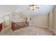 Spacious loft featuring stairs and railings and light fixtures at 3985 W 104Th Dr # E, Westminster, CO 80031