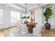 Dining room with modern chandelier and hardwood flooring at 2646 S Madison St, Denver, CO 80210