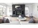 Bright living room featuring a stone fireplace and hardwood floors at 2646 S Madison St, Denver, CO 80210