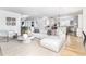 Spacious living room with hardwood floors, open to kitchen at 2646 S Madison St, Denver, CO 80210