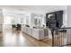 Bright living room featuring a stone fireplace, hardwood floors and comfortable furnishings at 2646 S Madison St, Denver, CO 80210