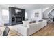 Living room featuring a stone fireplace and hardwood floors at 2646 S Madison St, Denver, CO 80210
