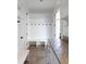 Mudroom features a bench with hooks, shelves, and counter space for storage at 2646 S Madison St, Denver, CO 80210