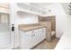Practical mud room includes a dog shower, cabinets, and shelves for storage solutions at 2646 S Madison St, Denver, CO 80210