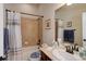 Cozy bathroom with tub and shower combination, single sink vanity, and neutral color scheme at 15088 Verbena St, Thornton, CO 80602