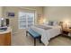 Bright bedroom features neutral paint, carpet and window with bright natural light at 15088 Verbena St, Thornton, CO 80602