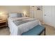 Bedroom with neutral walls, carpet, and a comfortable bed with ample lighting at 15088 Verbena St, Thornton, CO 80602