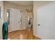 Inviting foyer with hardwood floors, a bright entryway, and natural light at 15088 Verbena St, Thornton, CO 80602