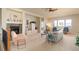Spacious living room with a cozy fireplace and bright natural light at 15088 Verbena St, Thornton, CO 80602