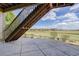 View from a large patio showing lovely open space with neighboring homes in the distance at 15088 Verbena St, Thornton, CO 80602