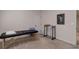 A serene room features carpet and a treatment table with a white door at 15088 Verbena St, Thornton, CO 80602