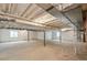 Unfinished basement with exposed ceiling, concrete floors, and insulated walls at 5385 Trails Edge Ln, Castle Rock, CO 80104