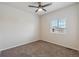 This simple bedroom features neutral paint, carpet, and a window with blinds at 5385 Trails Edge Ln, Castle Rock, CO 80104