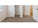 This bedroom features neutral paint, carpet, a closet, and lots of natural light at 5385 Trails Edge Ln, Castle Rock, CO 80104