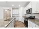 Bright kitchen featuring stainless appliances, granite counters and lots of cabinet space at 5385 Trails Edge Ln, Castle Rock, CO 80104