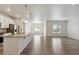 Open-concept kitchen and living space with an island and stainless steel appliances at 5385 Trails Edge Ln, Castle Rock, CO 80104