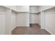 The walk-in closet features neutral paint, carpet, and open shelving at 5385 Trails Edge Ln, Castle Rock, CO 80104