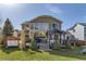 Exterior view of the home's back facade, showing the back deck, hot tub and gazebo at 7378 Geode Ct, Castle Rock, CO 80108