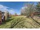 Large, grassy backyard features playground and space for Gathering fun at 7378 Geode Ct, Castle Rock, CO 80108