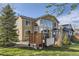 Exterior of a home featuring a backyard with a hot tub, gazebo, and lush greenery at 7378 Geode Ct, Castle Rock, CO 80108
