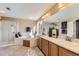Bright bathroom featuring dual sinks and a walk-in shower, providing plenty of room at 7378 Geode Ct, Castle Rock, CO 80108