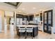 Modern kitchen with dark cabinetry, a center island with seating, and stainless-steel appliances at 7378 Geode Ct, Castle Rock, CO 80108