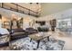 Open-concept living room featuring a modern staircase, high ceilings and seamless flow into the kitchen at 7378 Geode Ct, Castle Rock, CO 80108