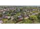 An aerial view displays a neighborhood with mature trees and landscaping in a suburban community at 10759 Clermont St, Thornton, CO 80233