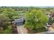 Aerial view of home showcasing its driveway and mature yard at 10759 Clermont St, Thornton, CO 80233