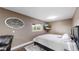 Bedroom with a queen bed, wood floors, and a mounted flatscreen television at 10759 Clermont St, Thornton, CO 80233