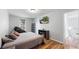 A cozy bedroom features wood floors, a television, and a therapeutic massage chair at 10759 Clermont St, Thornton, CO 80233