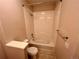 Bathroom featuring a tub/shower combo and white fixtures at 15700 E Jamison Dr # 3-202, Englewood, CO 80112