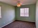 Bedroom with neutral walls, carpeted floors and a ceiling fan with light fixture at 15700 E Jamison Dr # 3-202, Englewood, CO 80112