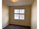 Bedroom with neutral walls, carpeted floors and a bright window at 15700 E Jamison Dr # 3-202, Englewood, CO 80112
