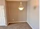 Dining room featuring neutral colors and a chandelier at 15700 E Jamison Dr # 3-202, Englewood, CO 80112