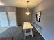 Dining area with modern lighting fixture at 15700 E Jamison Dr # 3-202, Englewood, CO 80112