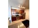 Well-lit kitchen featuring stainless steel appliances and wooden cabinetry at 15700 E Jamison Dr # 3-202, Englewood, CO 80112