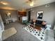 Inviting living room features a modern sofa, decorative rug, and a ceiling fan at 15700 E Jamison Dr # 3-202, Englewood, CO 80112