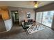 Comfortable living room with a view of the balcony at 15700 E Jamison Dr # 3-202, Englewood, CO 80112