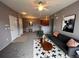 Inviting living room features a modern sofa, decorative rug, and a ceiling fan at 15700 E Jamison Dr # 3-202, Englewood, CO 80112